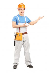 Manual worker with tool belt and helmet